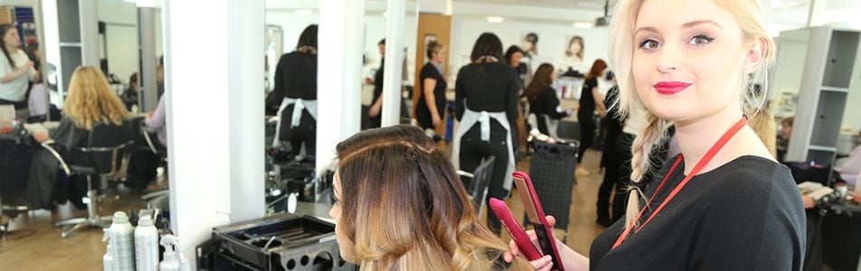 hairdressing student smiling at the camera